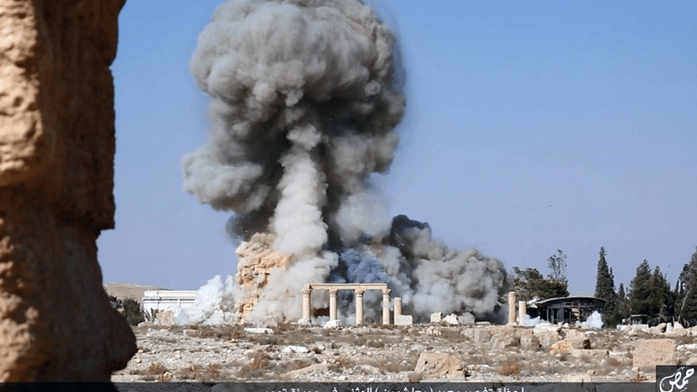 This undated file photo posted on a social media site on Aug. 25, 2015, by Islamic State militants, shows smoke from the detonation of the 2,000-year-old temple of Baalshamin in Syria’s ancient caravan city of Palmyra. (Photo: AP)