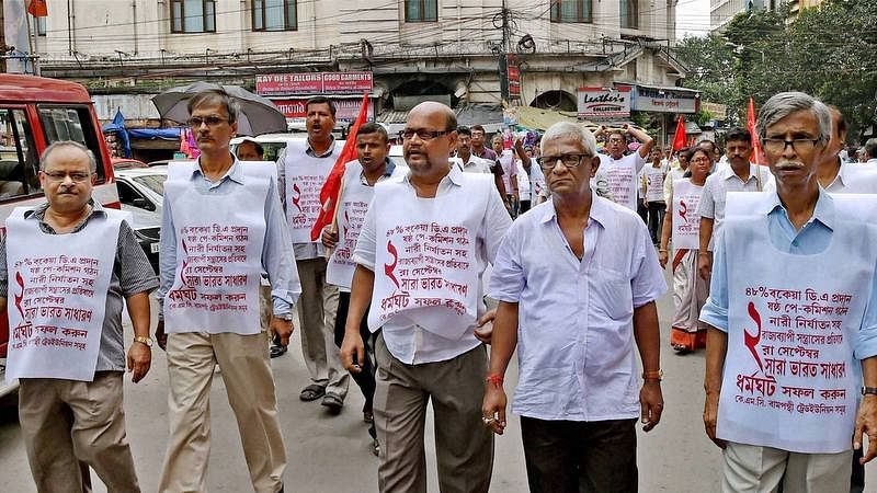  CITU activists participate in a rally in support of the September 2 strike to protest against the proposed labour reforms by Central and State government, in Kolkata on Monday. (Photo: PTI)