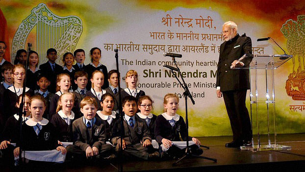 Narendra Modi watching a performance by the children during an interaction with the Indian community in Dublin. (Photo: PTI)