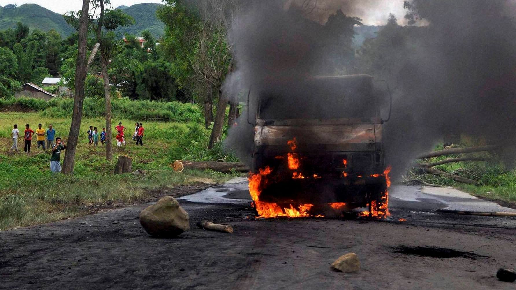 Protesters burn a police vehicle in Churachandpur district of Manipur on Tuesday in protest against the passage of allegedly “anti-tribal” bills in the Manipur assembly. (Photo: PTI)