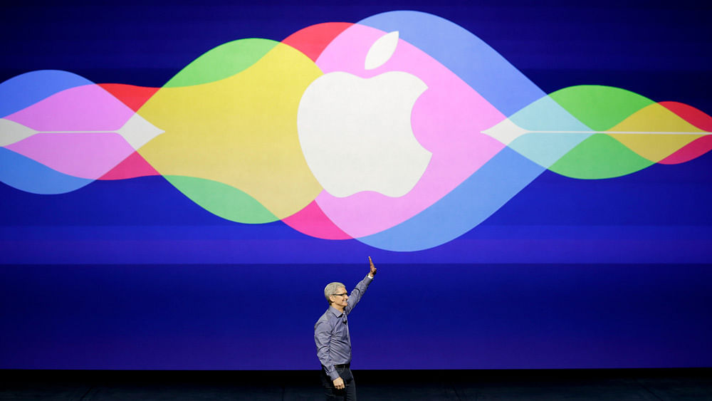 Apple CEO Tim Cook waves during the Apple event in San Francisco. (Photo: AP)