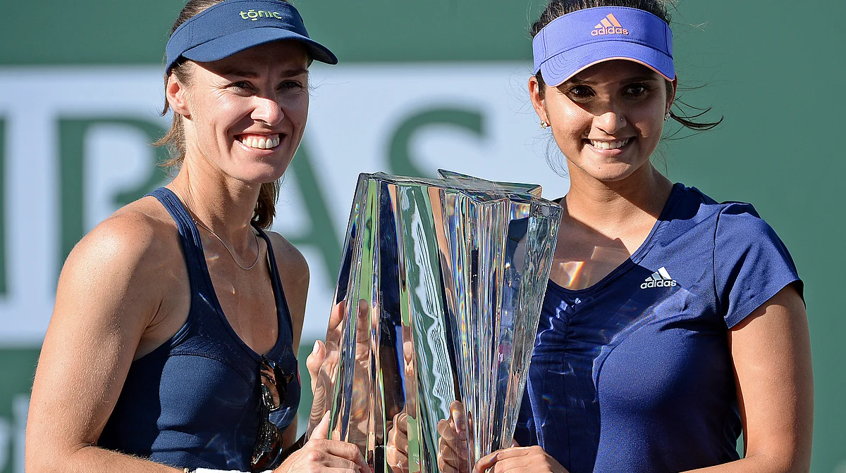 Martina Hingis and Sania Mirza pose with their BNP Paribas Open trophy at Indian Wells in March. (Photo: Reuters)
