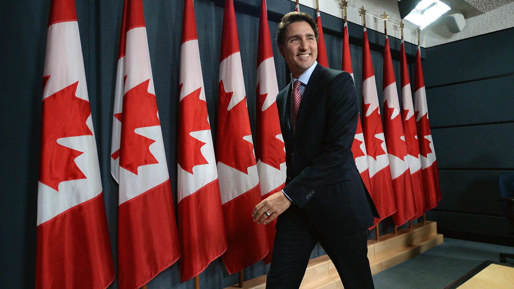 Canadian Prime Minister-designate Justin Trudeau smiles as he leaves his first news conference since winning the election. (Photo: AP)