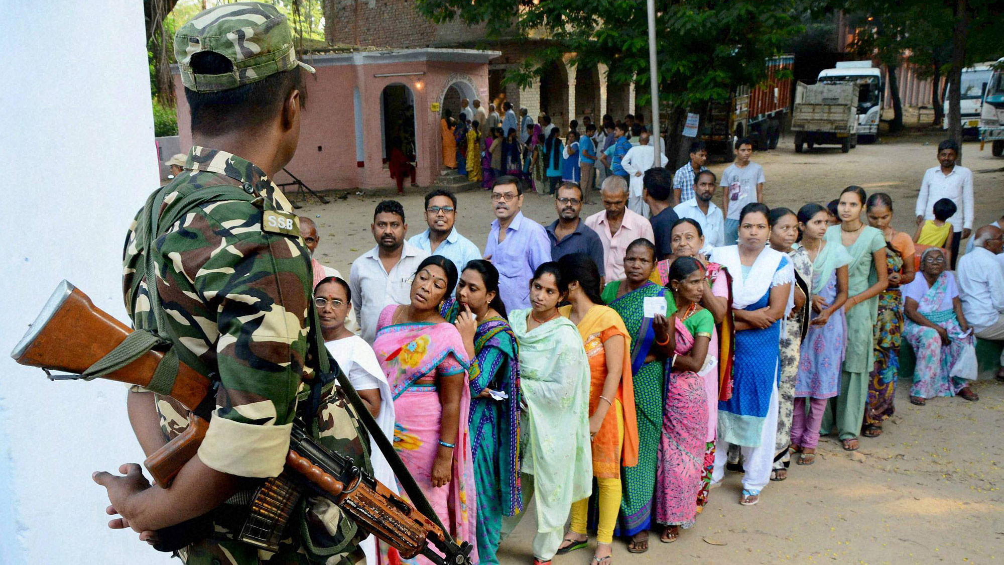 Voters wait in queues to cast their vote during the second phase of Bihar elections in  Gaya, October 16, 2015. (Photo: PTI)