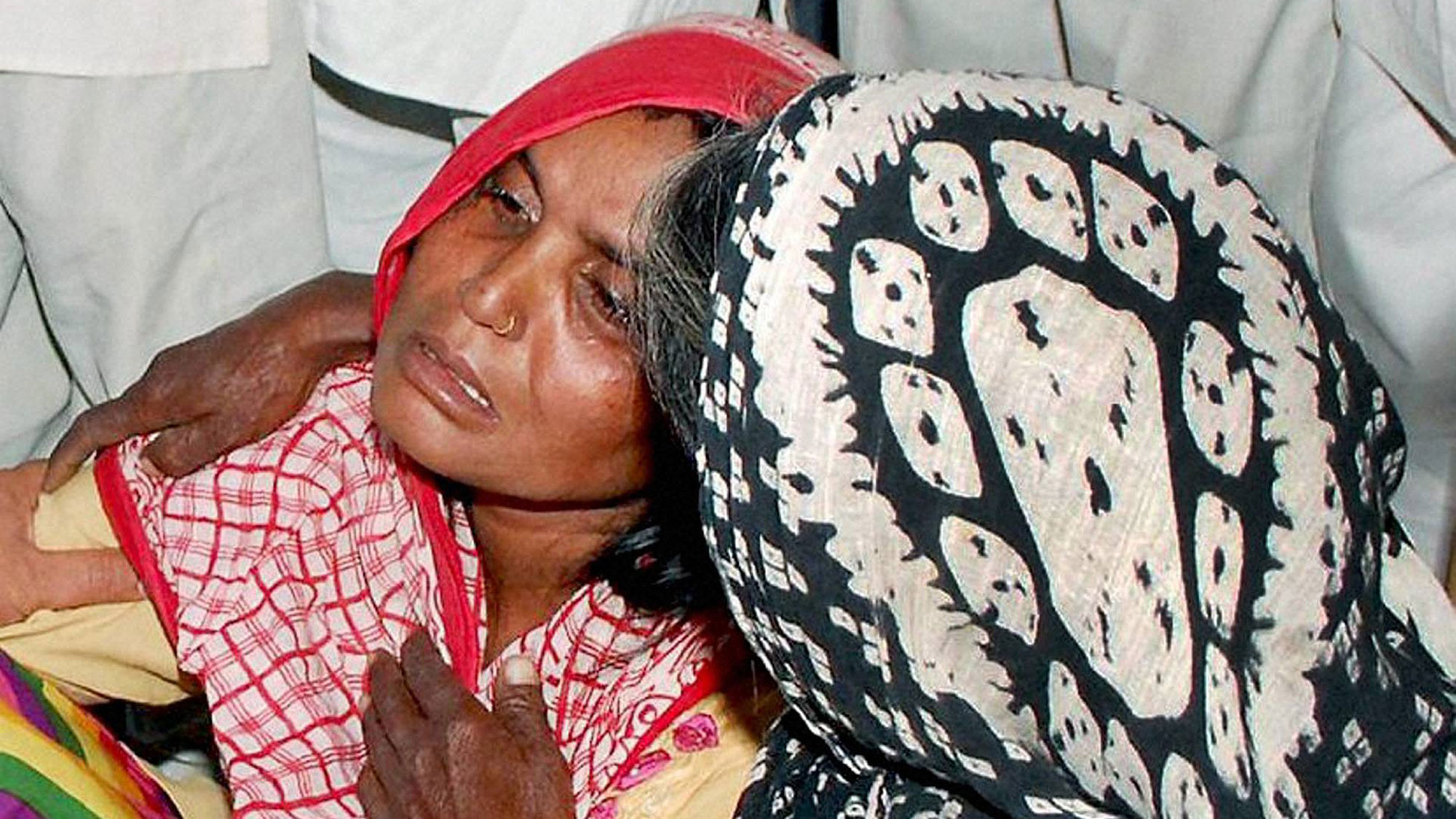 Family members of Govinda (15), who was found hanging outside his house. (Photo: PTI)