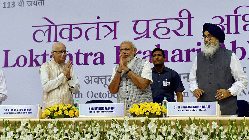 Prime Minister Narendra Modi, senior BJP leader LK Advani and Punjab CM Parkash Singh Badal during the Loktantra Prahari Abhinandan event. (Photo: PTI)
