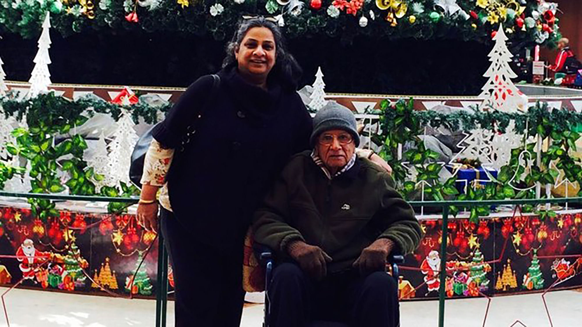Sangeeta Murthi Sahgal at a city mall with her father who was diagnosed with Parkinson’s Disease in 2008. (Photo Courtesy: Sangeeta Murthi Sahgal). 