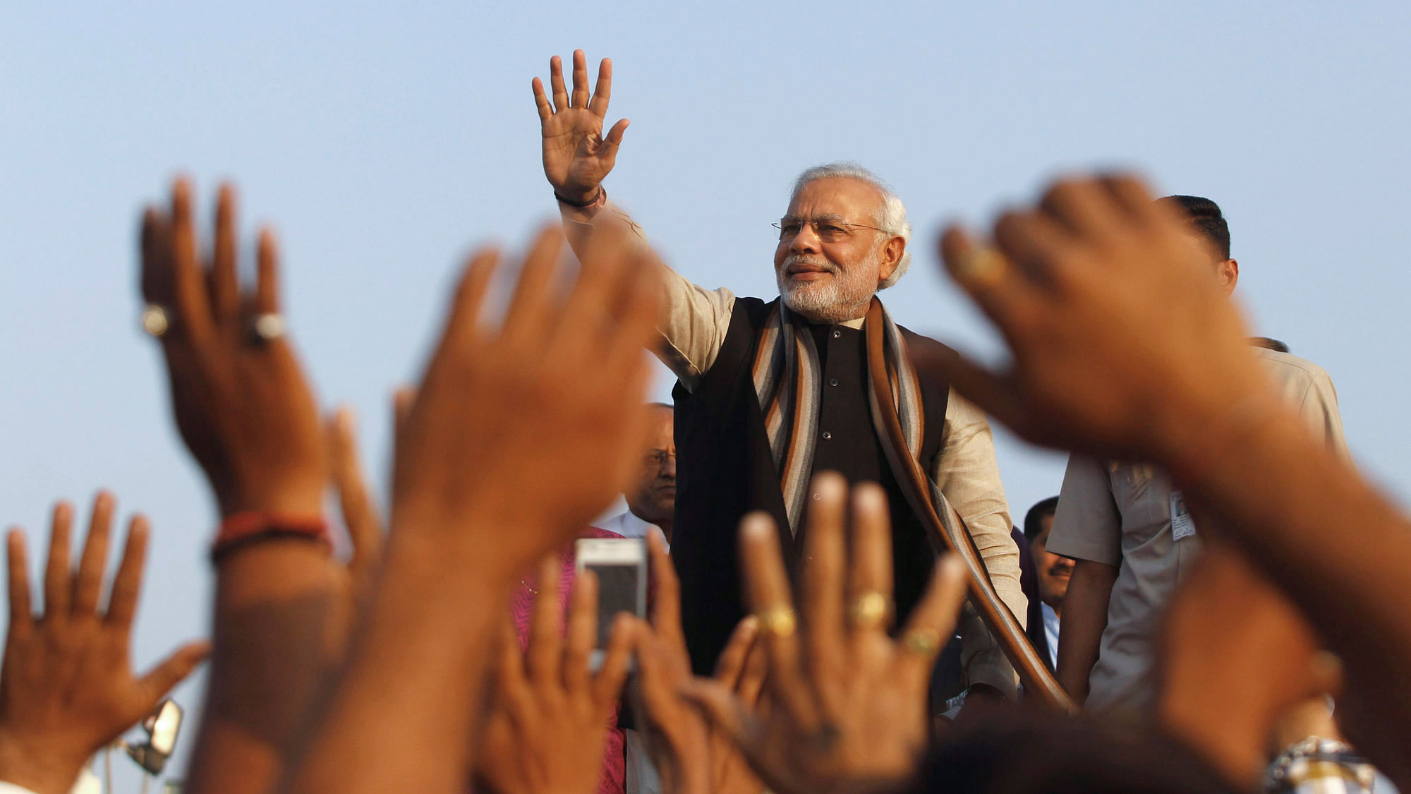 Prime Minister Narendra Modi waves to the crowd at a rally while campaigning for the 2014 Lok Sabha Elections. (Photo: Reuters)