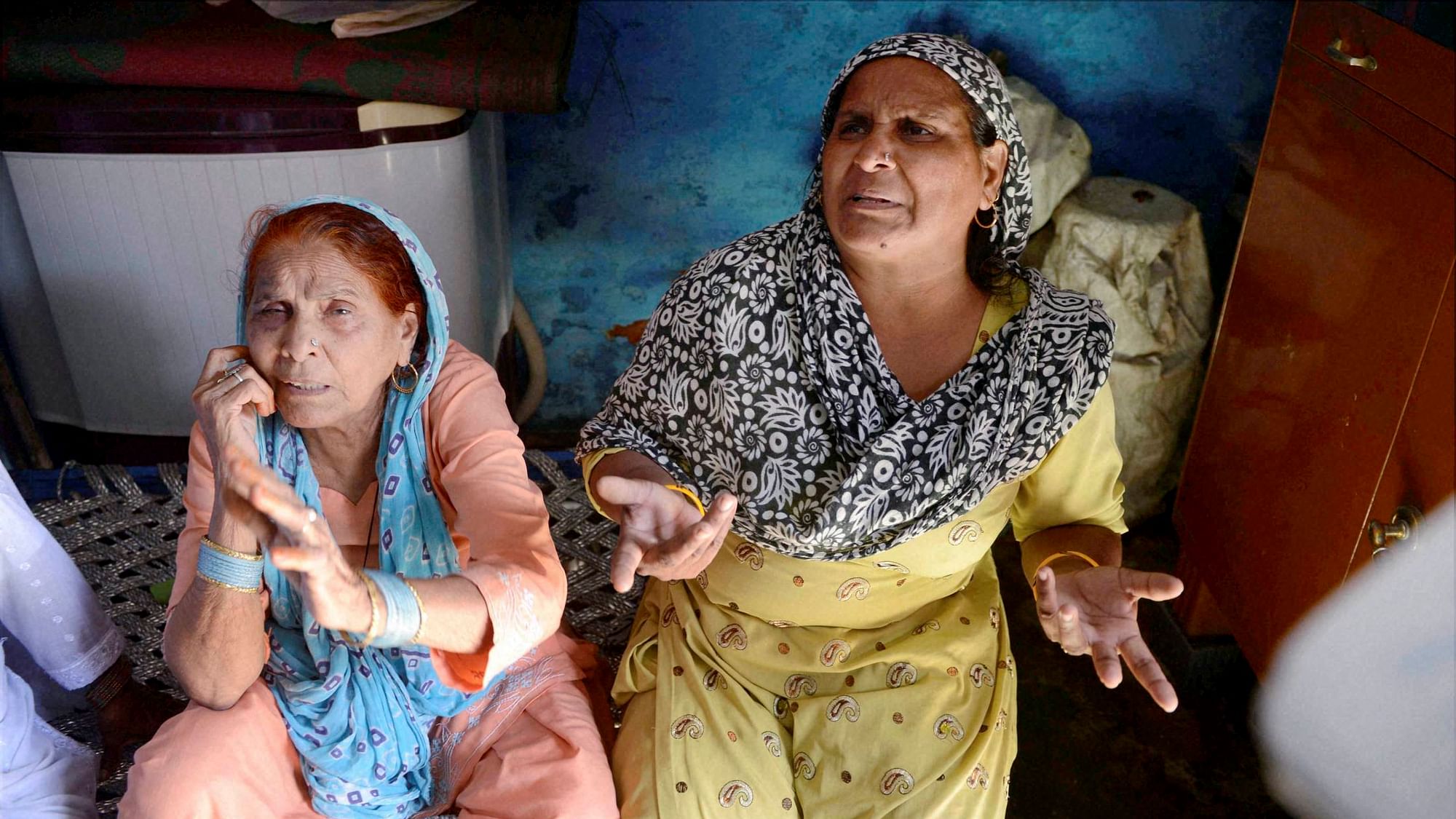 File image of relatives mourning the death of farmer Mohammad Akhlaq at his home in Bisara village about 45 kilometers from New Delhi. (Photo: PTI)