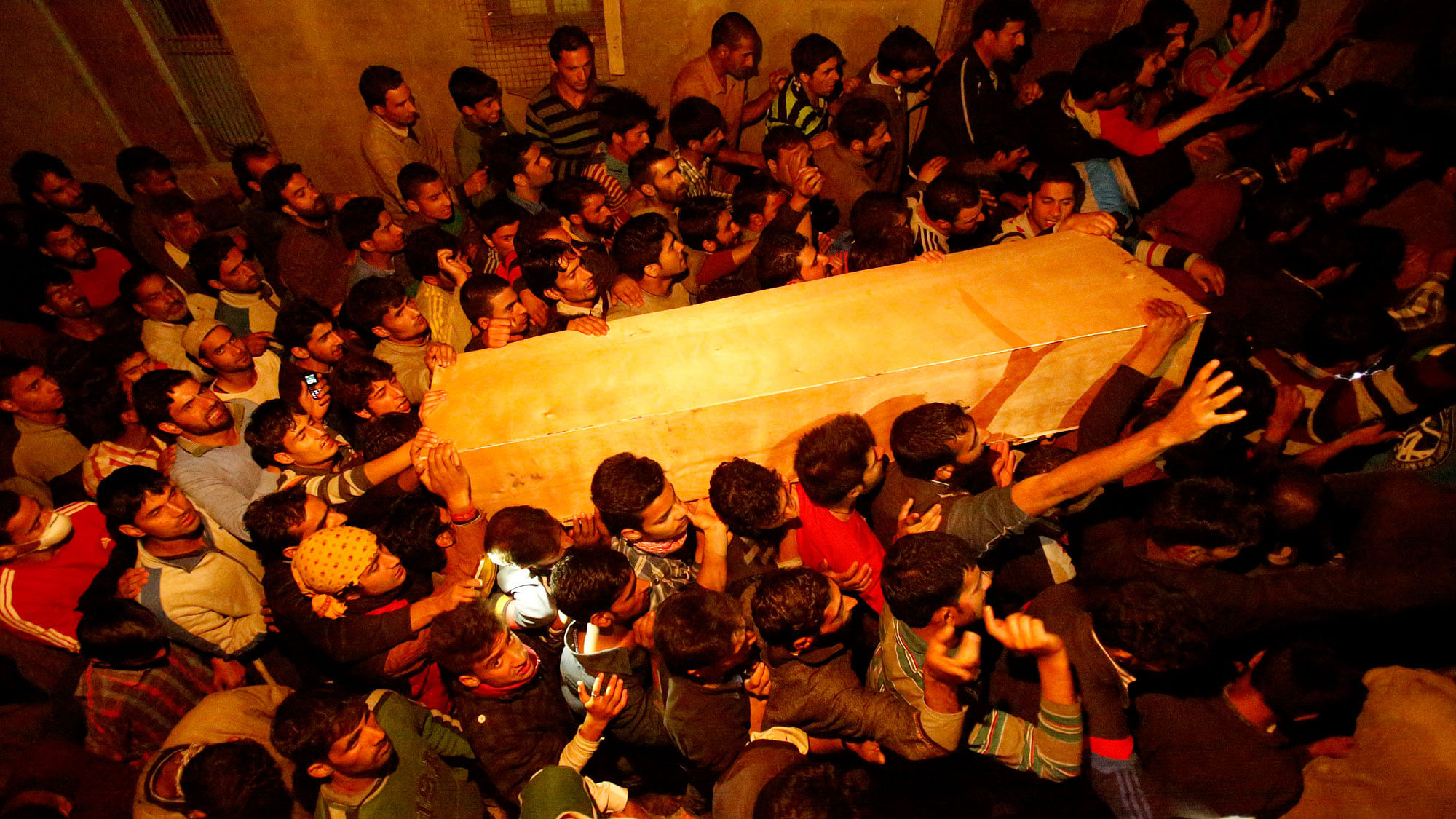 Kashmiri Muslim villagers carrying Zahid Ahmed’s coffin in Batango village, Srinagar. (Photo: AP)