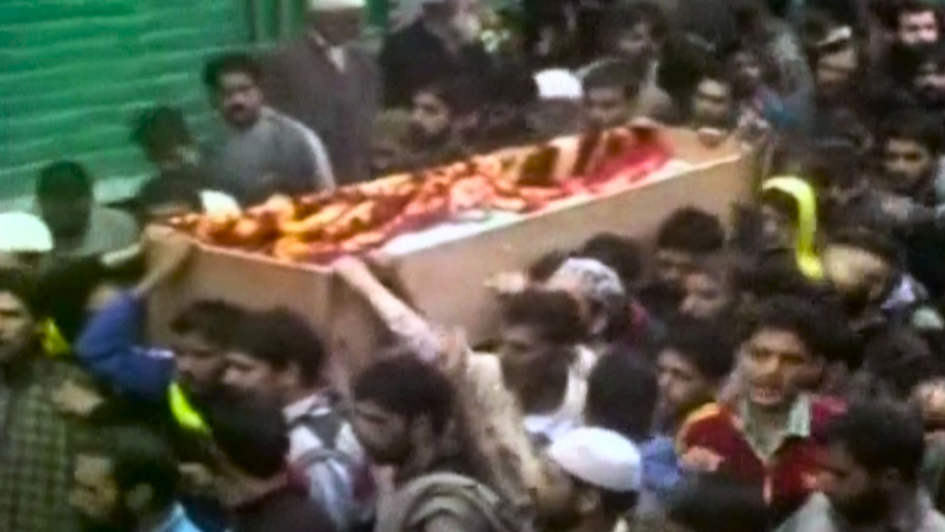 Locals carry Bhat’s body for last rites in Kashmir. (Photo: ANI screengrab)