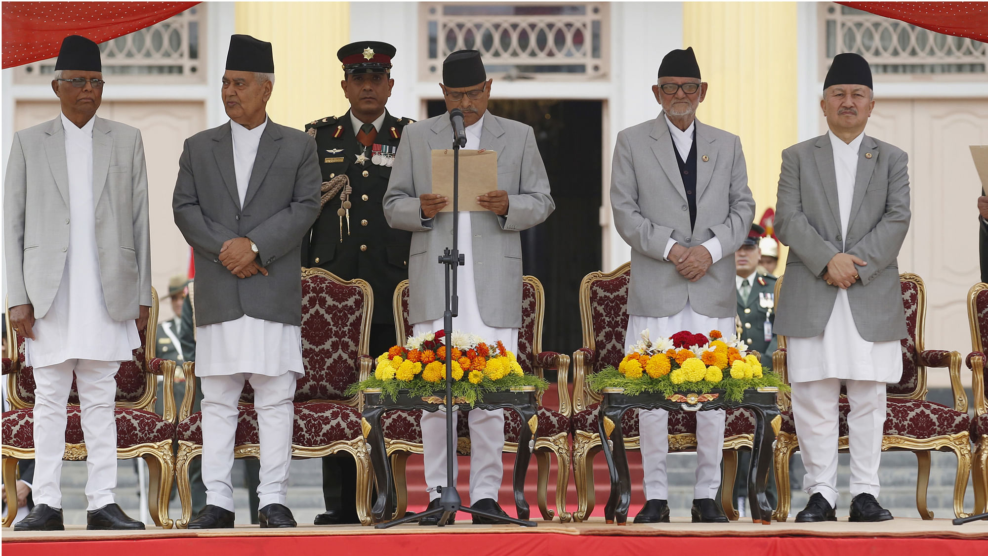 Nepal’s President Ram Baran Yadav (front 3rd L) administers the oath of office to the country’s newly-elected Prime Minister Khadga Prashad Sharma Oli. (Photo: Reuters)