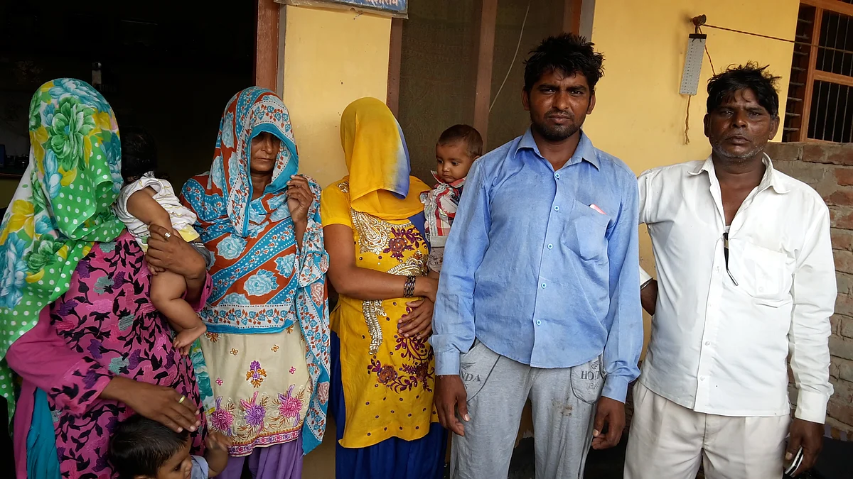 The three women of the family with their toddlers. Other relatives, Sudesh (left) and Lakshman Singh (Right) (Photo: Poonam Agarwal)