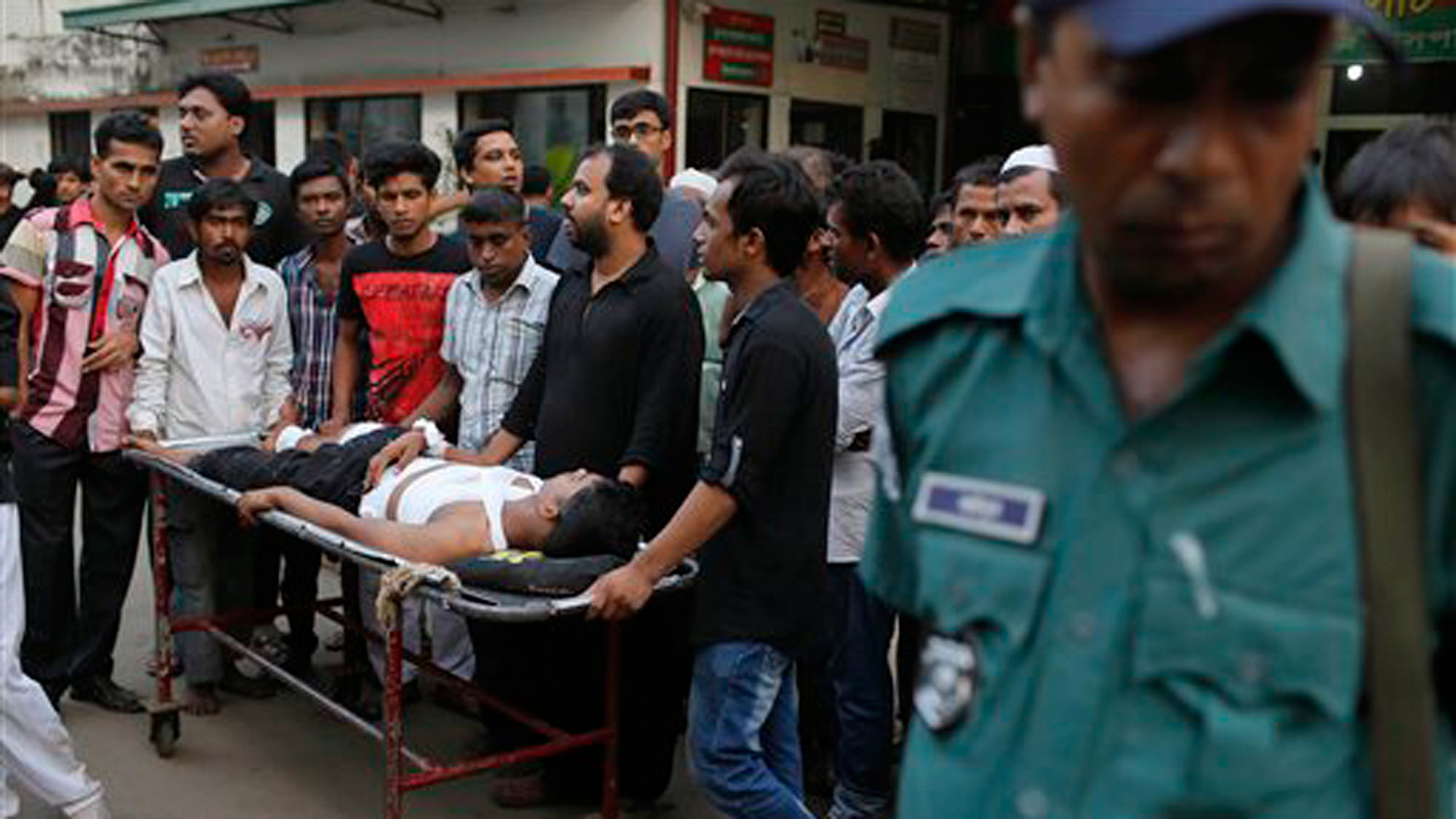 A person injured in the explosion being carried outside a hospital in Dhaka, Bangladesh on Oct. 24, 2015. (Photo: AP)