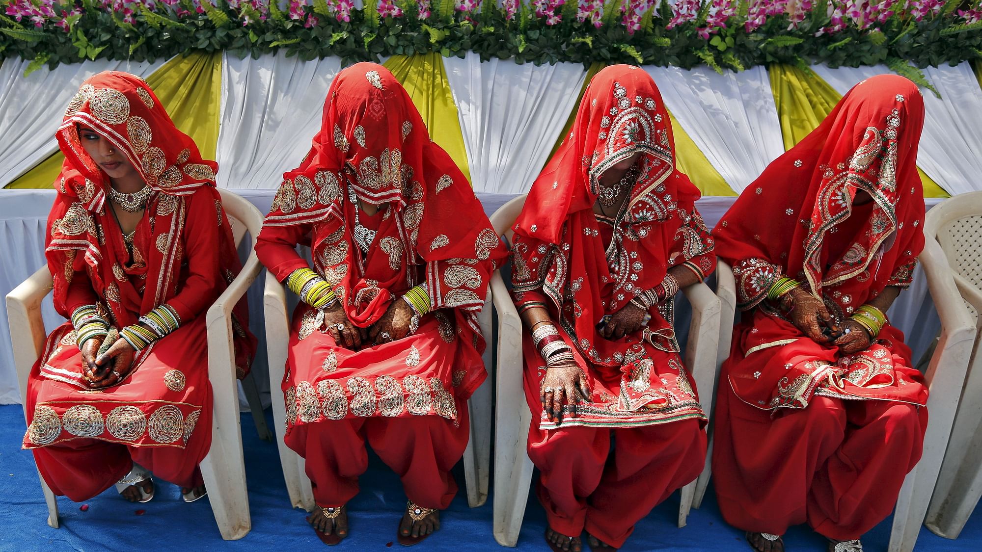 Muslim brides wait for the start of a mass marriage ceremony in Ahmedabad. (Photo: Reuters)