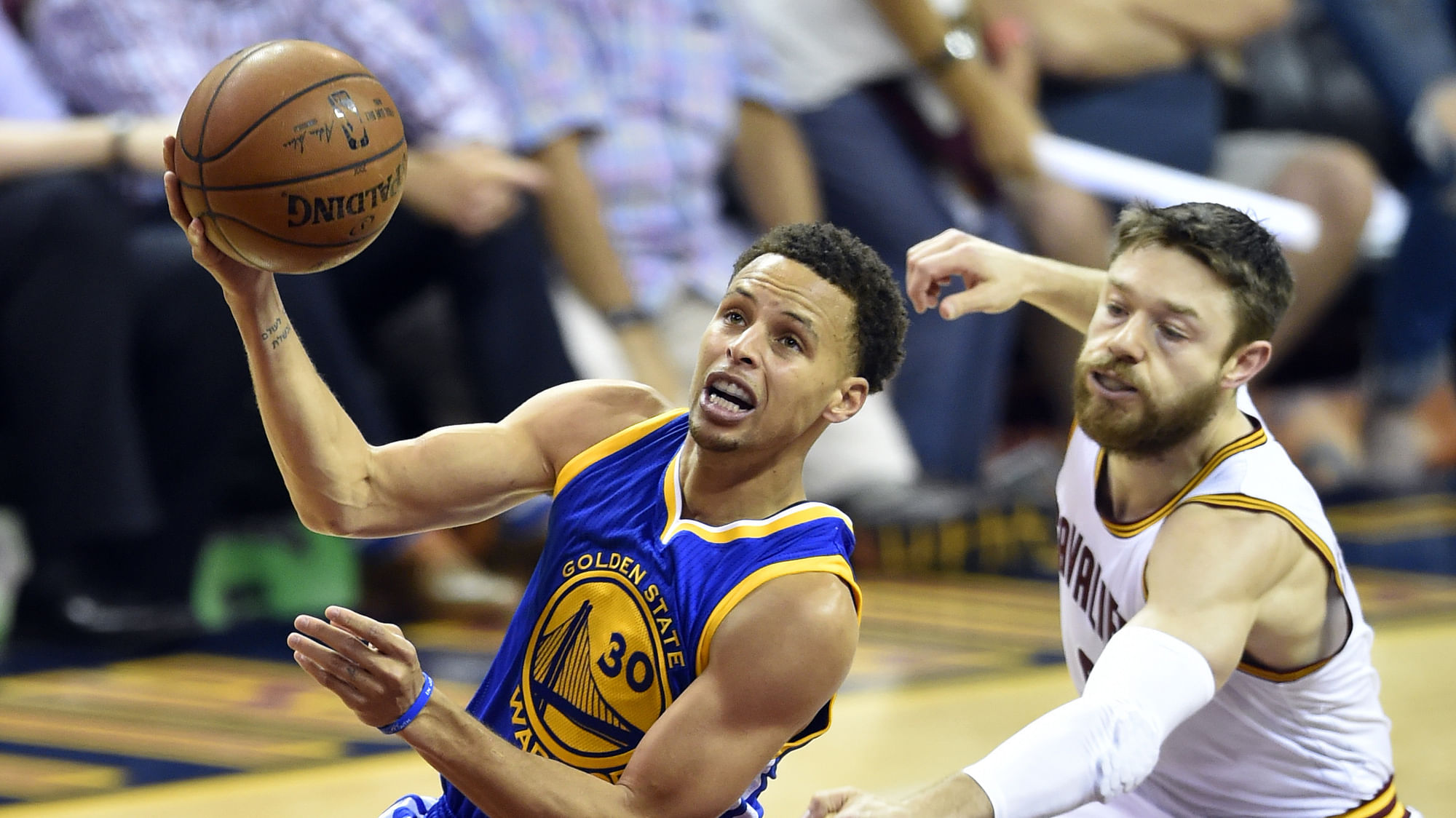 Golden State Warriors guard Stephen Curry (30) drives to the basket against Cleveland Cavaliers guard Matthew Dellavedova (8) during the first quarter of game six of the NBA Finals at Quicken Loans Arena. (Photo: Reuters) 