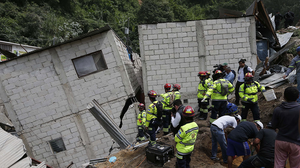 Heavy rains sent earth and rock cascading over homes and trapping residents inside. (Photo: AP)