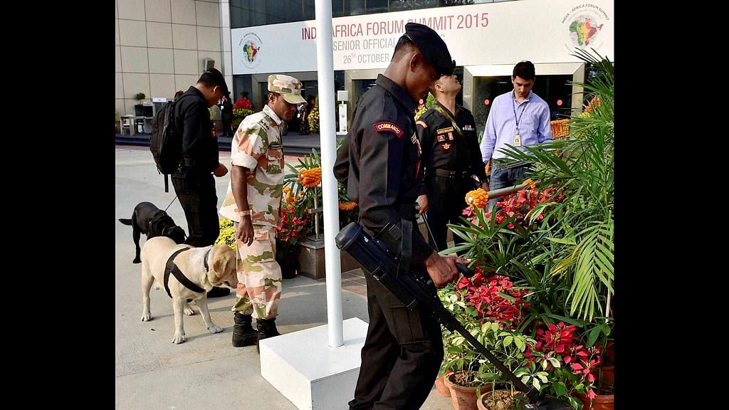  Security men with sniffer dogs check the venue before the  meeting of senior officials at the India Africa Forum Summit. (Photo: PTI)