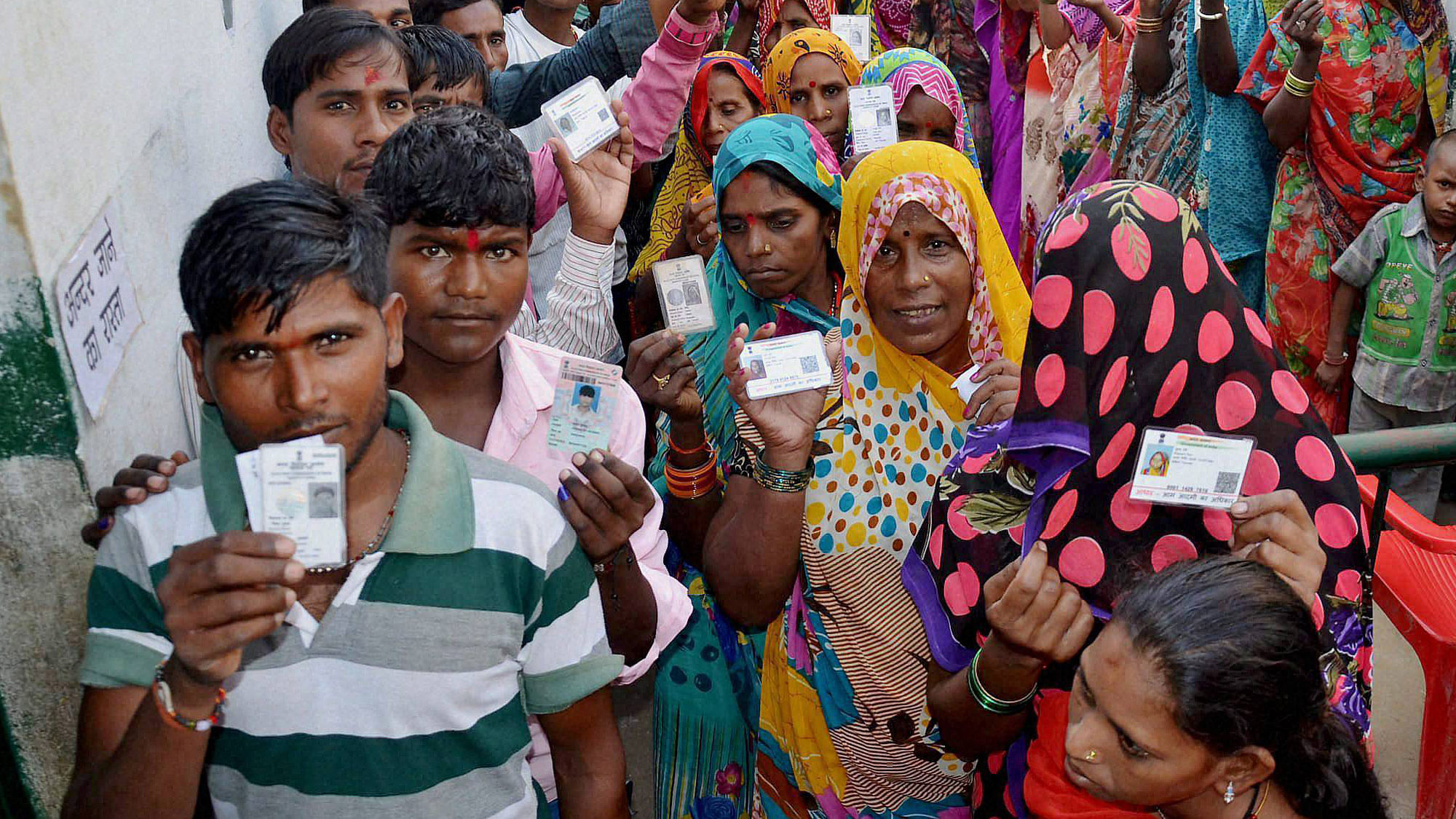 Voters wait in queues to cast their votes in the second phase of the UP panchayat polls in Mirzapur on October 13, 2015. (Photo: PTI)