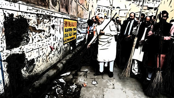 Prime Minister Modi taking part in the Swachh Bharat campaign. 