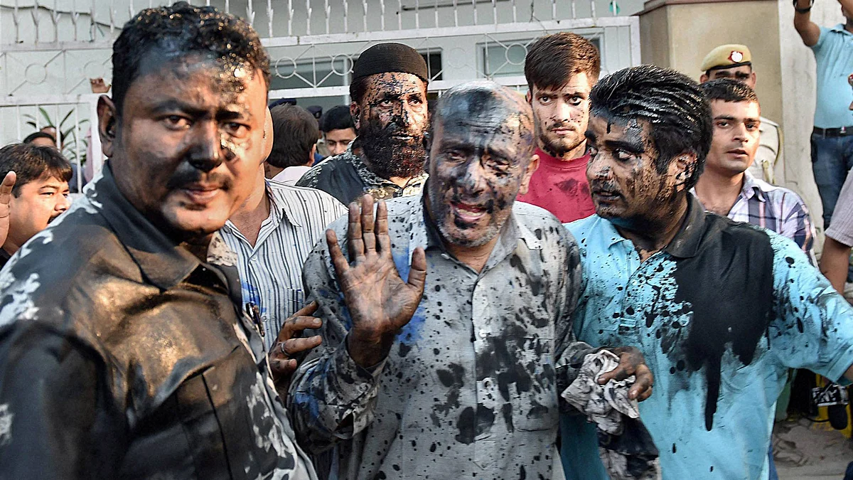 J&K MLA Abdul Rashid Sheikh’s face was blackened by a few activists, allegedly belonging to a right-wing organisation, at the Press Club in New Delhi, October 19, 2015. (Photo: PTI)
