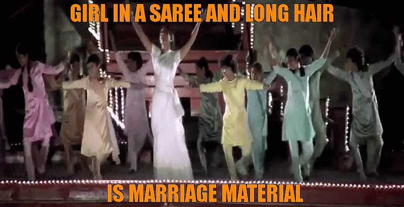 Shah Rukh finally falls for Kajol when she turns into a long haired sari clad demure beauty (Source: <a href="https://www.youtube.com/watch?v=O6lQD9YXnbU&feature=youtu.be">YouTube/ Khan HD Music 1080p</a>)