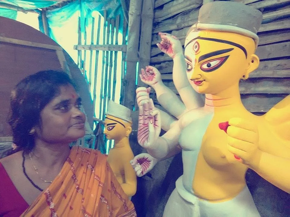 Artist China Pal with her creation, the unique ardhanarishwar Durga. (Photo Courtesy: Pratyay Gender Trust)