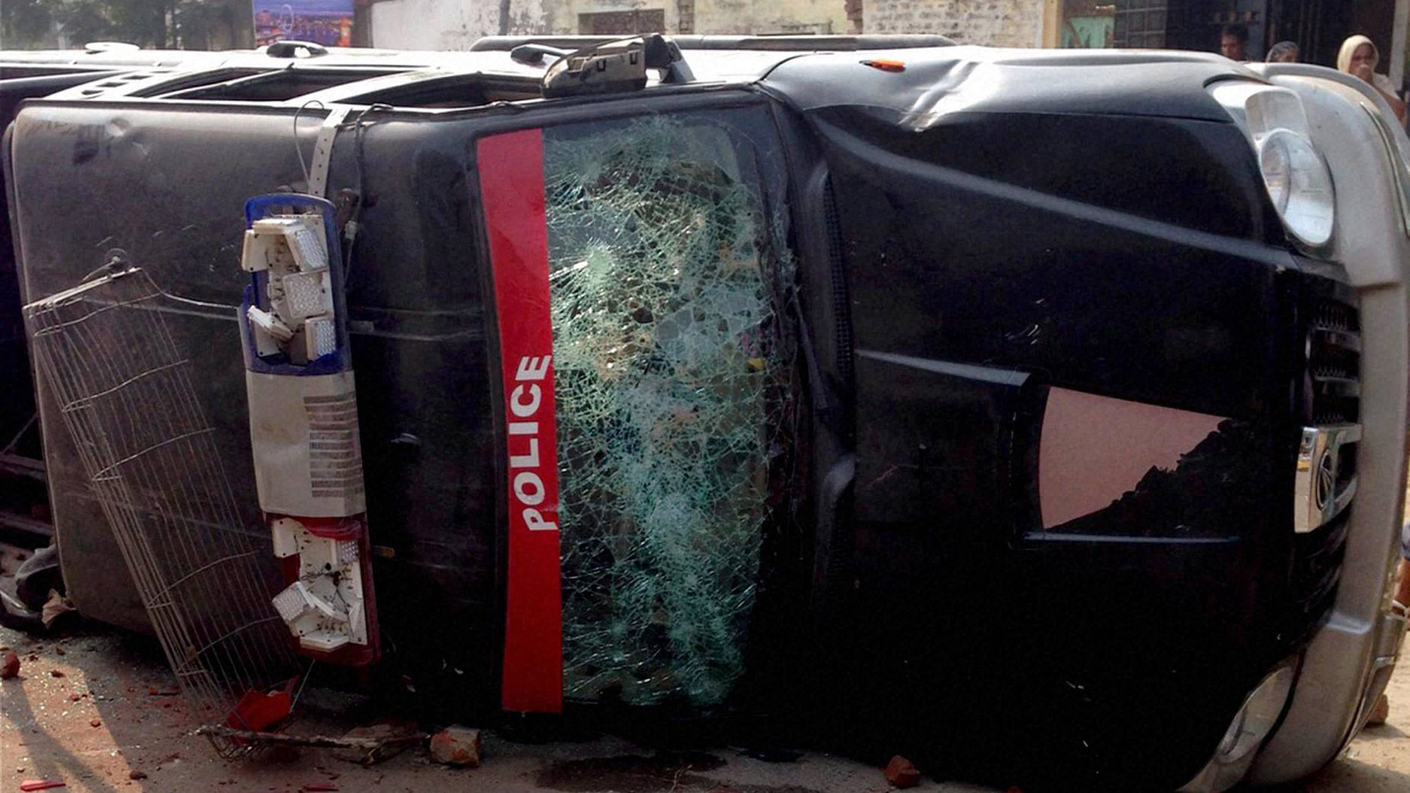 Damaged police vehicle after clashes with Sikh organizations  in Faridkot. (Photo: PTI)
