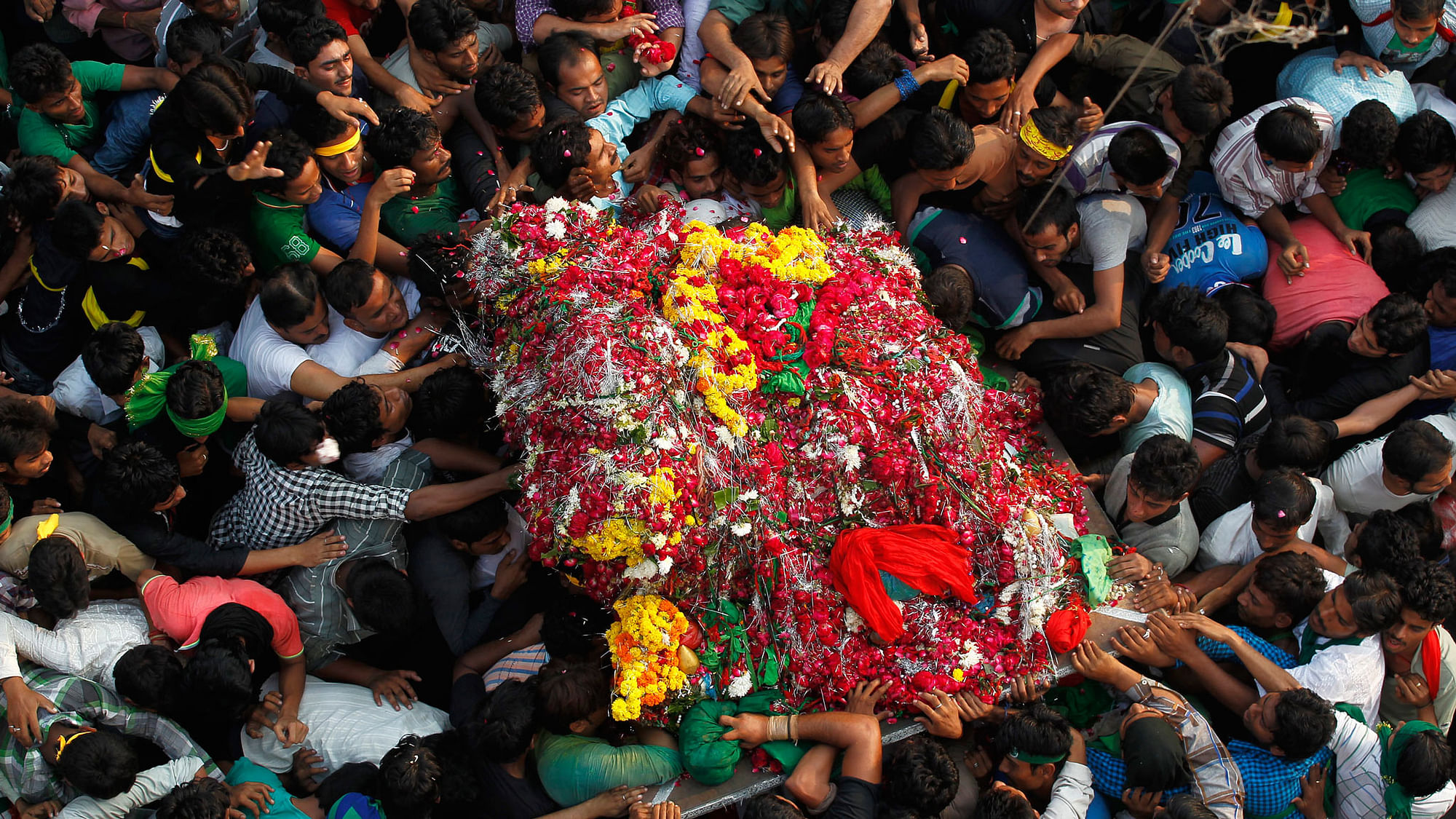 Shi’ite Muslims carry a “Tazia”, or a replica of the coffin of Imam Hussein, during a Muharram procession to mark Ashura in Allahabad.&nbsp;
