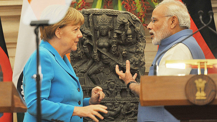 German Chancellor Angela Merkel (L) and Prime Minister Narendra Modi (R). (Photo:<a href="https://www.flickr.com/photos/meaindia/21951855692/in/album-72157659421031166/"> Flickr.com/MEAIndia</a>)
