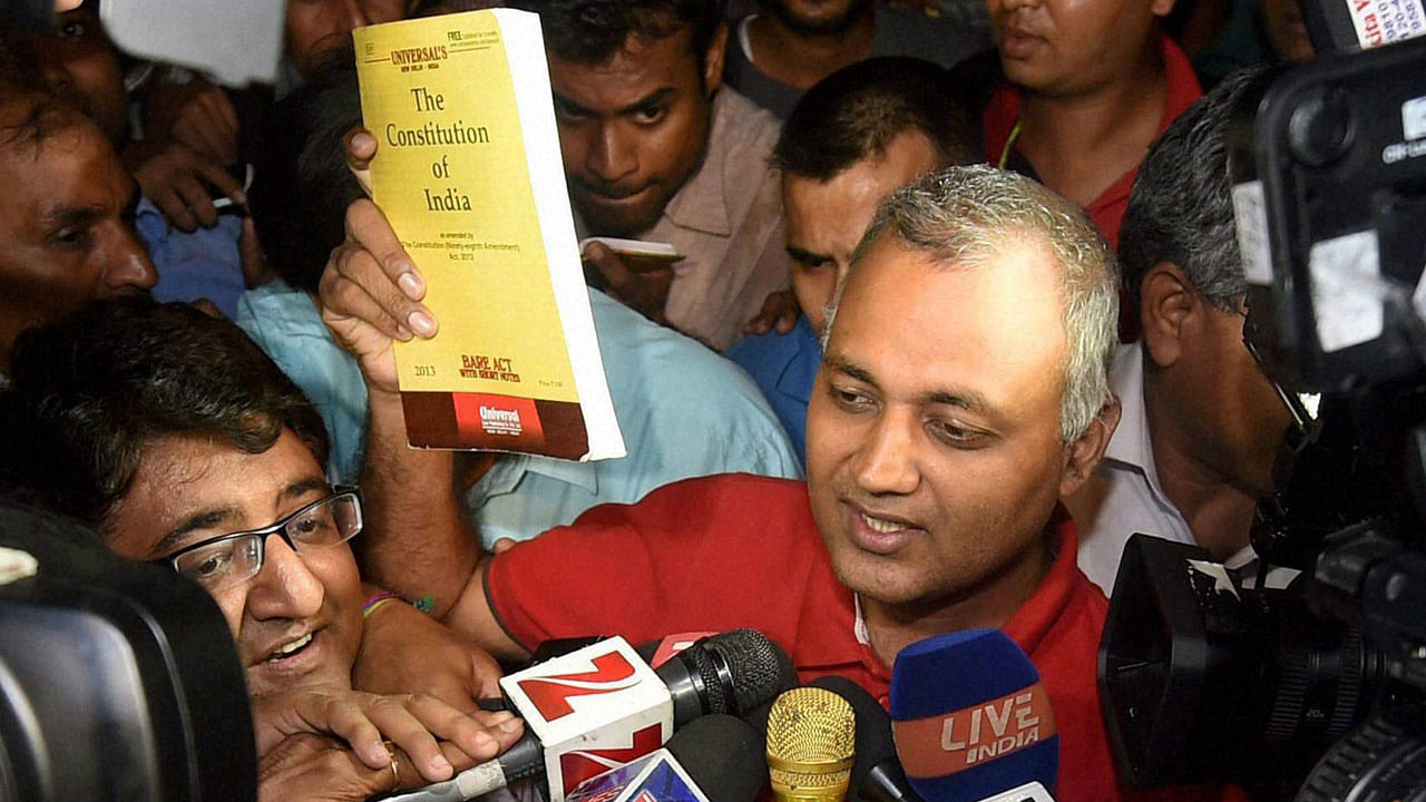 Somnath Bharti brandishing a copy of the Constitution. (Photo: The Quint)
