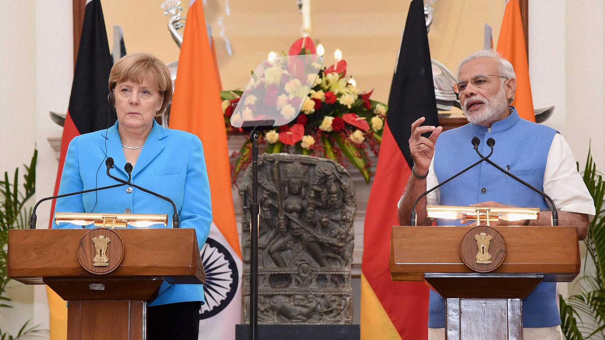 Prime Minister Narendra Modi (L) and German Chancellor Angela Merkel (R) at a joint press conference following a meeting at Hyderabad house in New Delhi on Monday. (Photo: PTI)