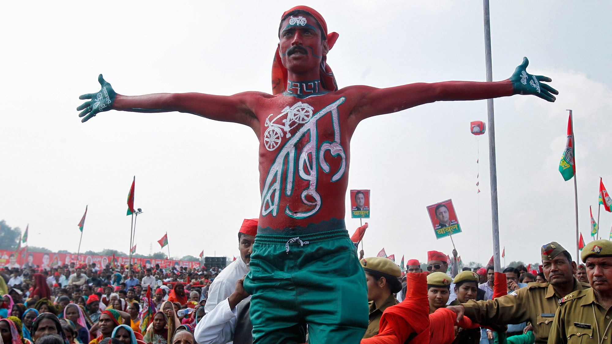 A supporter of Samajwadi Party with his body painted in the colours of the party attends a public rally being addressed by the party chief Mulayam Singh Yadav in Allahabad, March 2, 2014. (Photo: Reuters)