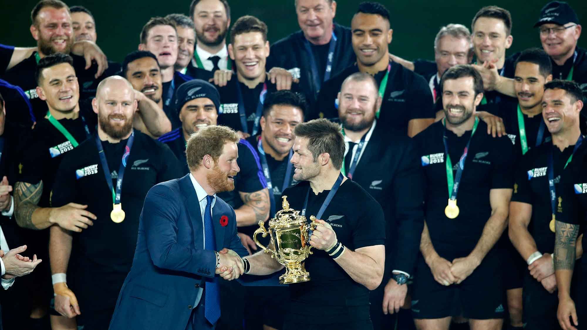 Britain’s Prince Harry presents the Webb Ellis trophy to New Zealand’s Richie McCaw after they defeated Australia 34-17 in the Rugby World Cup final. (Photo: AP)