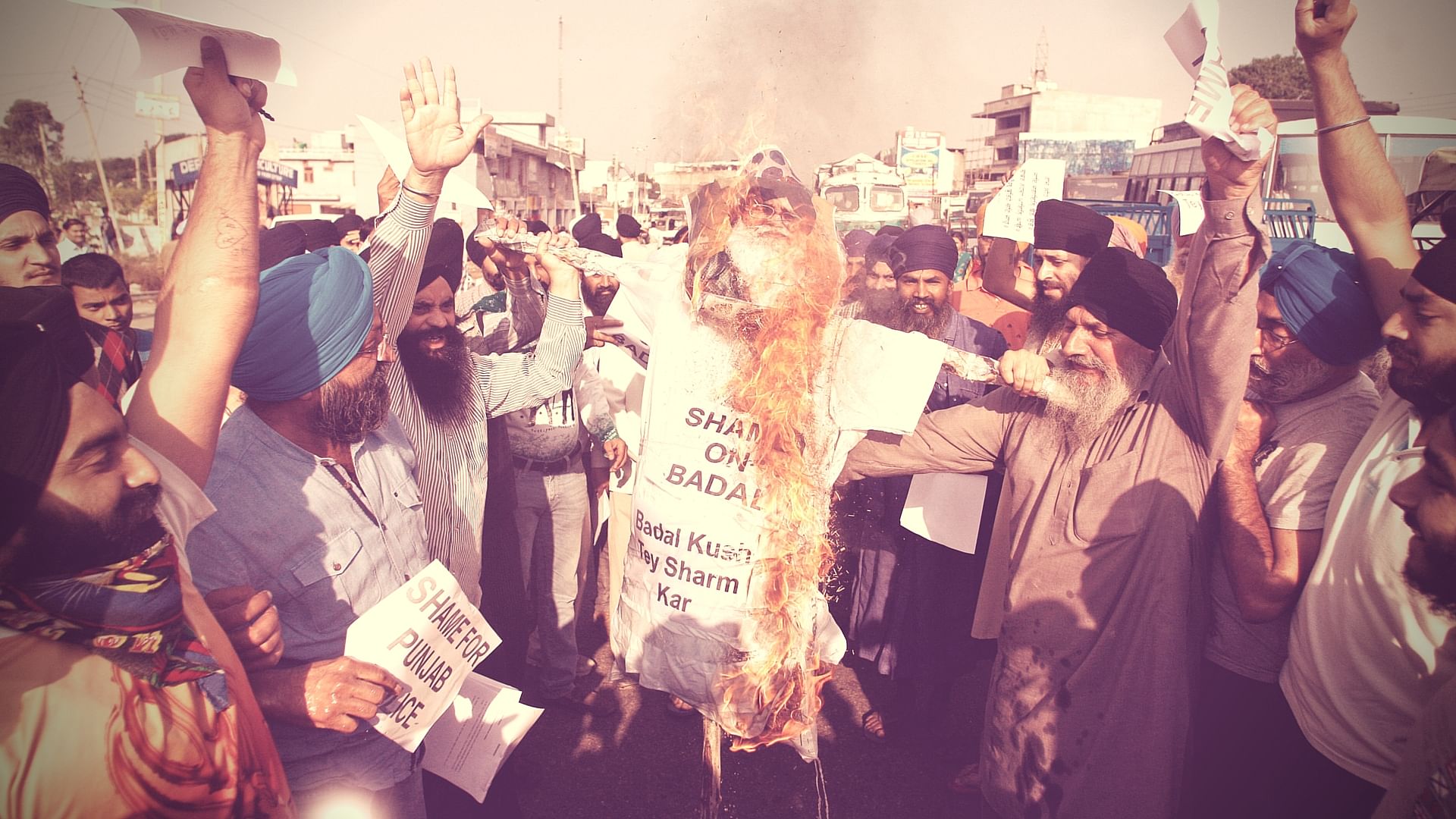 Sikhs burn an effigy of Punjab state Chief Minister Parkash Singh Badal during a protest against the killing of two Sikh boys. (Photo: AP)