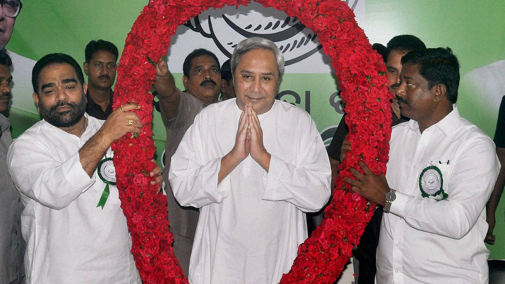 Odisha Chief Minister Naveen Patnaik is garlanded by BJD workers after his re-election as the party president during the party’s executive body meeting in Bhubaneswar, September 23, 2015. (Photo: PTI)