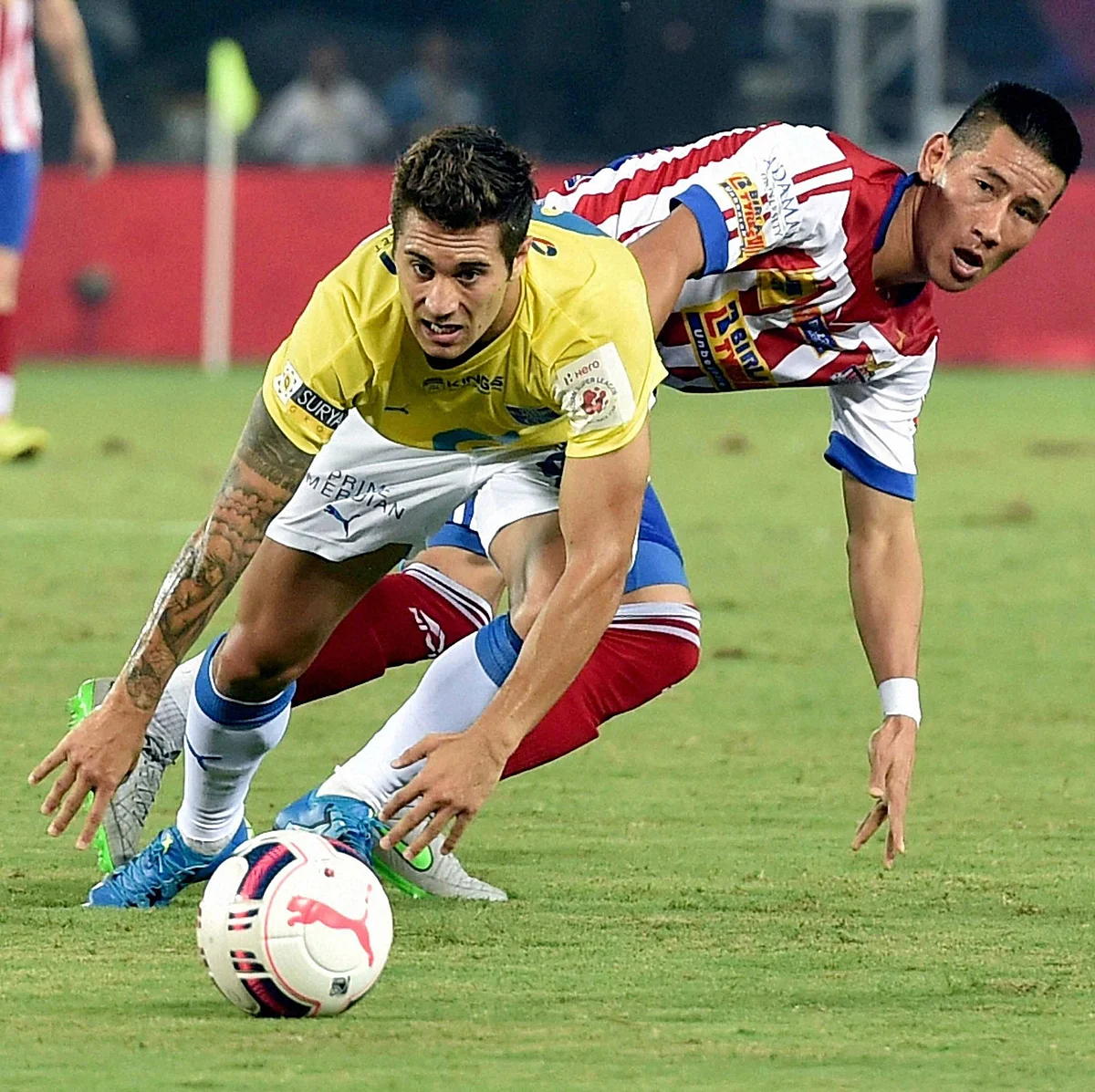 Atletico de Kolkata (red and white) and Kerala Blasters FC players in action during an ISL match in Kolkata. (Photo: PTI)