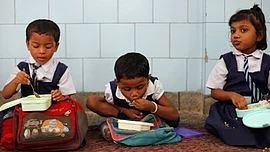 Representational image of children eating their mid-day meal in school. (Photo: Reuters)
