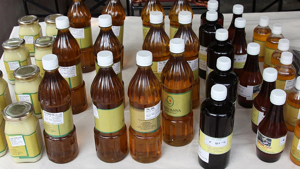 At the ongoing organic food festival at Delhi’s Dilli Haat, Vandana Shiva’s Navdanya is selling 700 ml of mustard oil for Rs 180 (or Rs 257 a litre). (Photo: Vivian Fernandes/<b>The Quint</b>)
