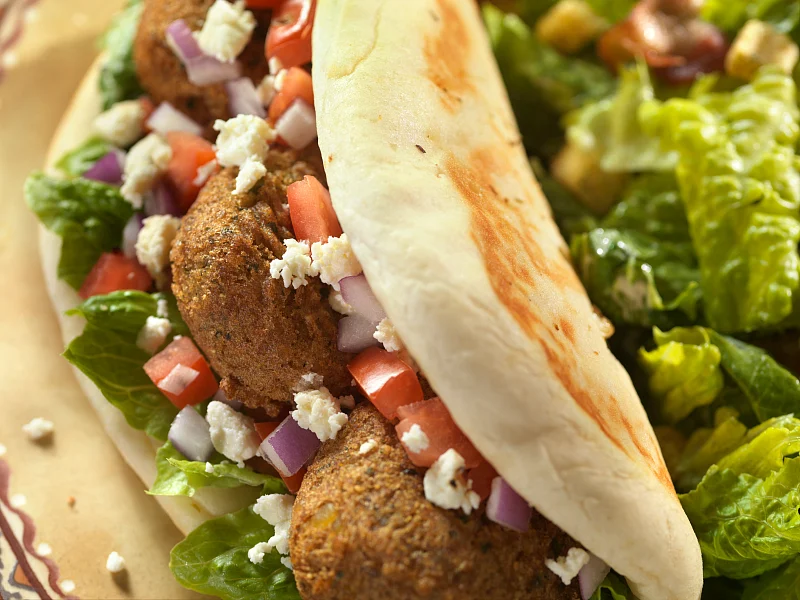 Falafel is sometimes served by itself, but it’s usually served wrapped inside of a pita or tortillas. 