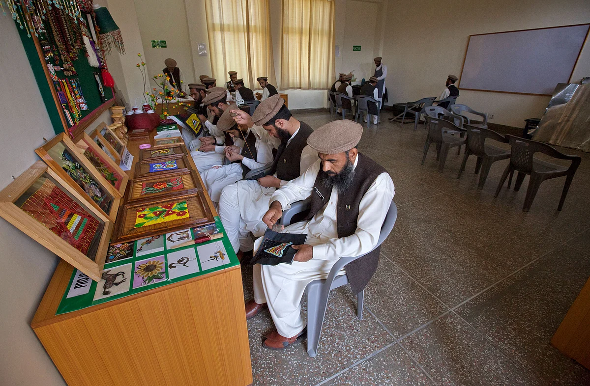 Men learn to create handicrafts in a classroom at the Mashal de-radicalisation centre run by the Pakistani army in Gulibagh, Pakistan’s Swat Valley. (Photo: Reuters)