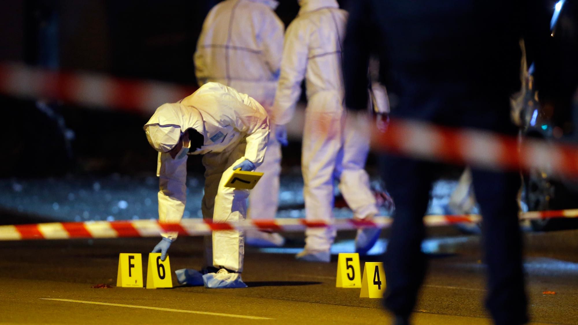 Investigating police officers work outside the Stade de France stadium. (Photo: AP)