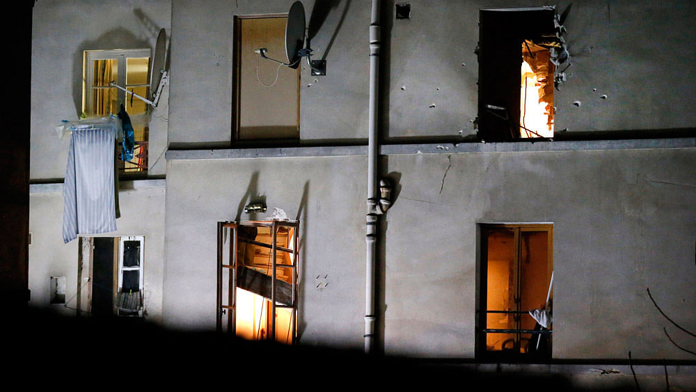 Bullet holes are pictured around a window in a house after an intervention of security forces against a group of extremists in Saint-Denis, near Paris, November 18, 2015. (Photo: AP)