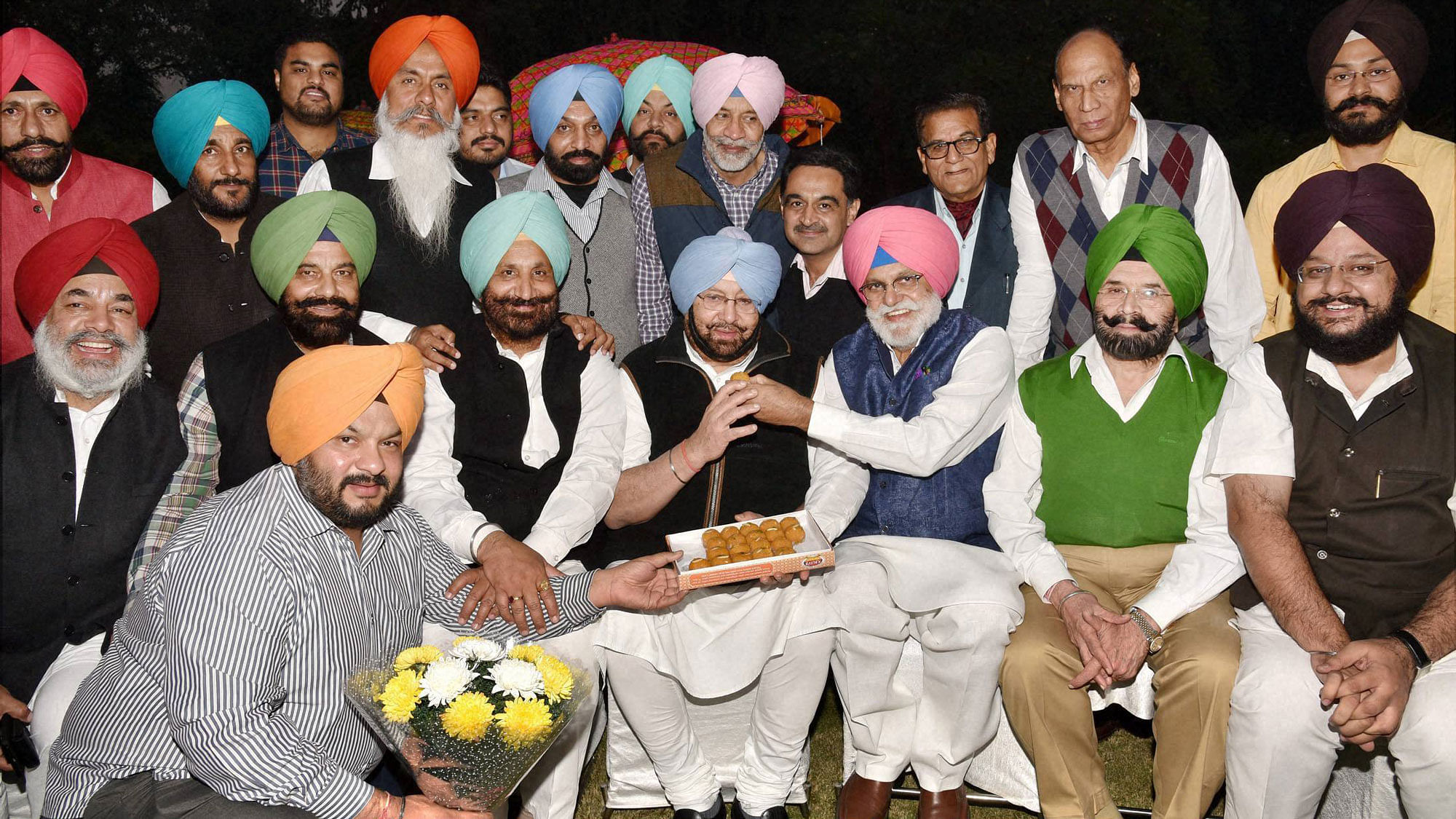 Capt Amarinder Singh celebrating with supporters after he was appointed President of Punjab Pradesh Congress Committee, in New Delhi, on Friday. PTI Photo