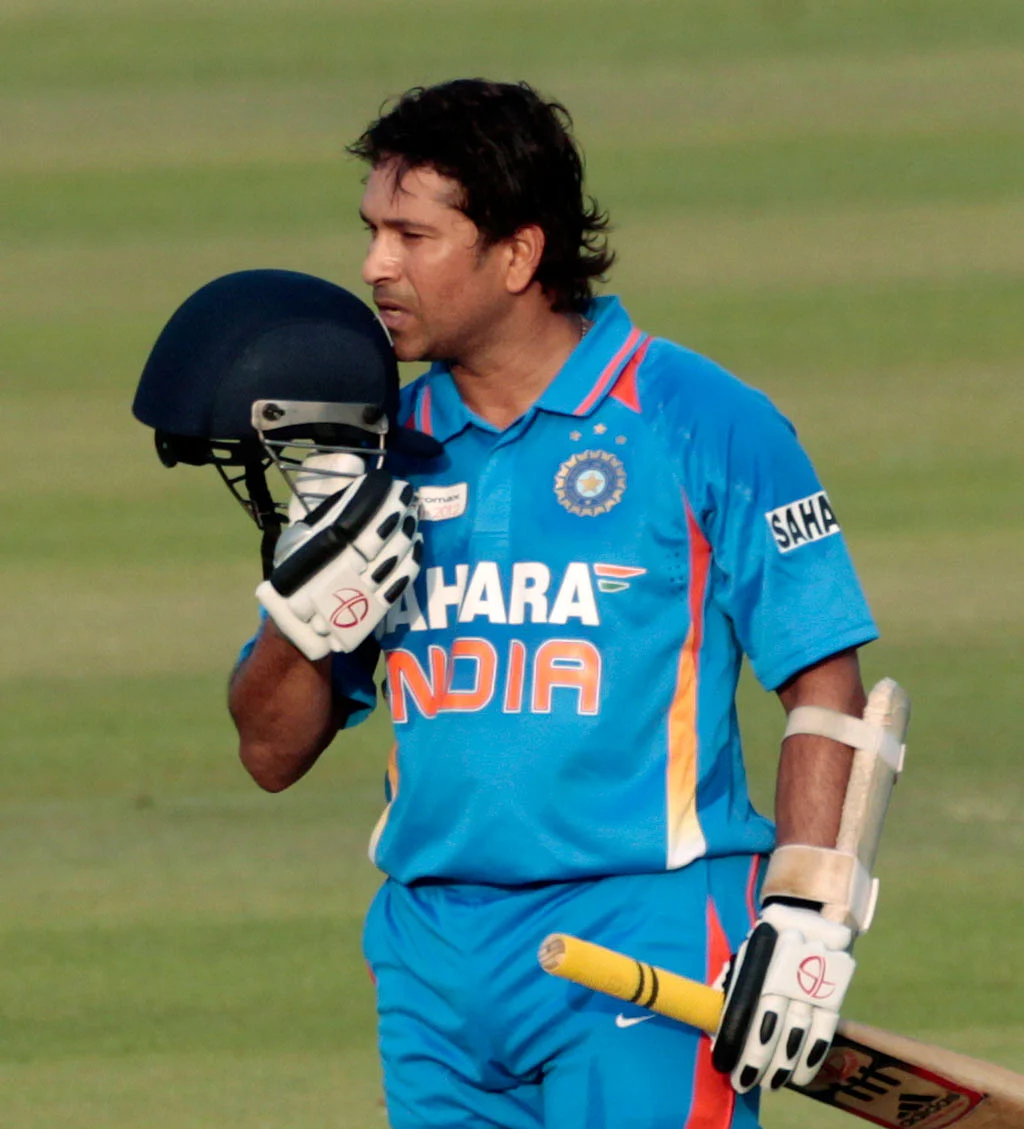 Sachin Tendulkar kisses his helmet after scoring his 100th hundred. (Photo: Reuters)