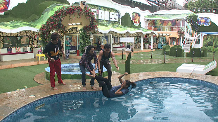 The boys throw Rochelle into the pool
