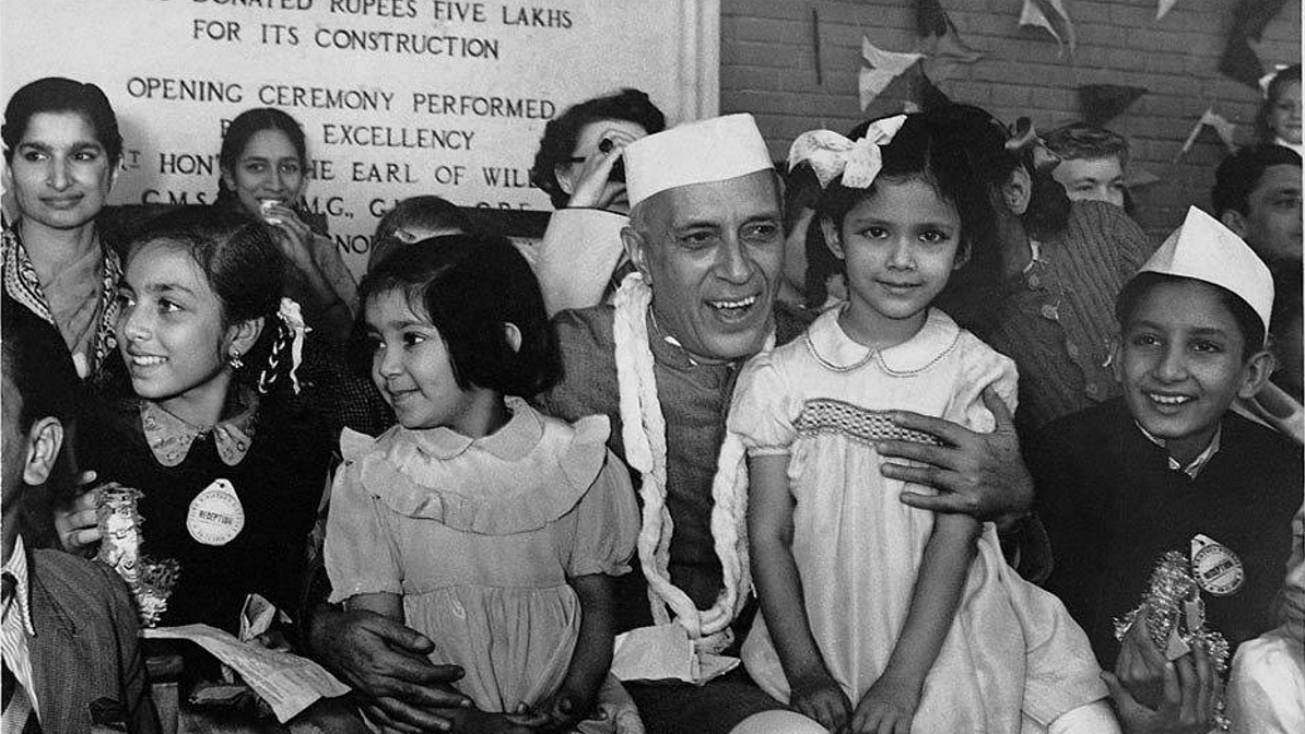 <div class="paragraphs"><p>A bunch of young kids pose with Jawaharlal Nehru on his birthday </p></div>