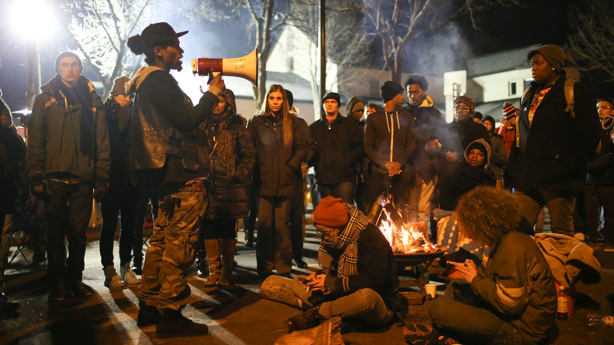 A demonstrator speaks about his encounter with attackers near the Minneapolis Police 4th Precinct earlier in the night, as protesters gather in front of the precinct in Minneapolis on Tuesday, November 24, 2015. (Photo: AP)