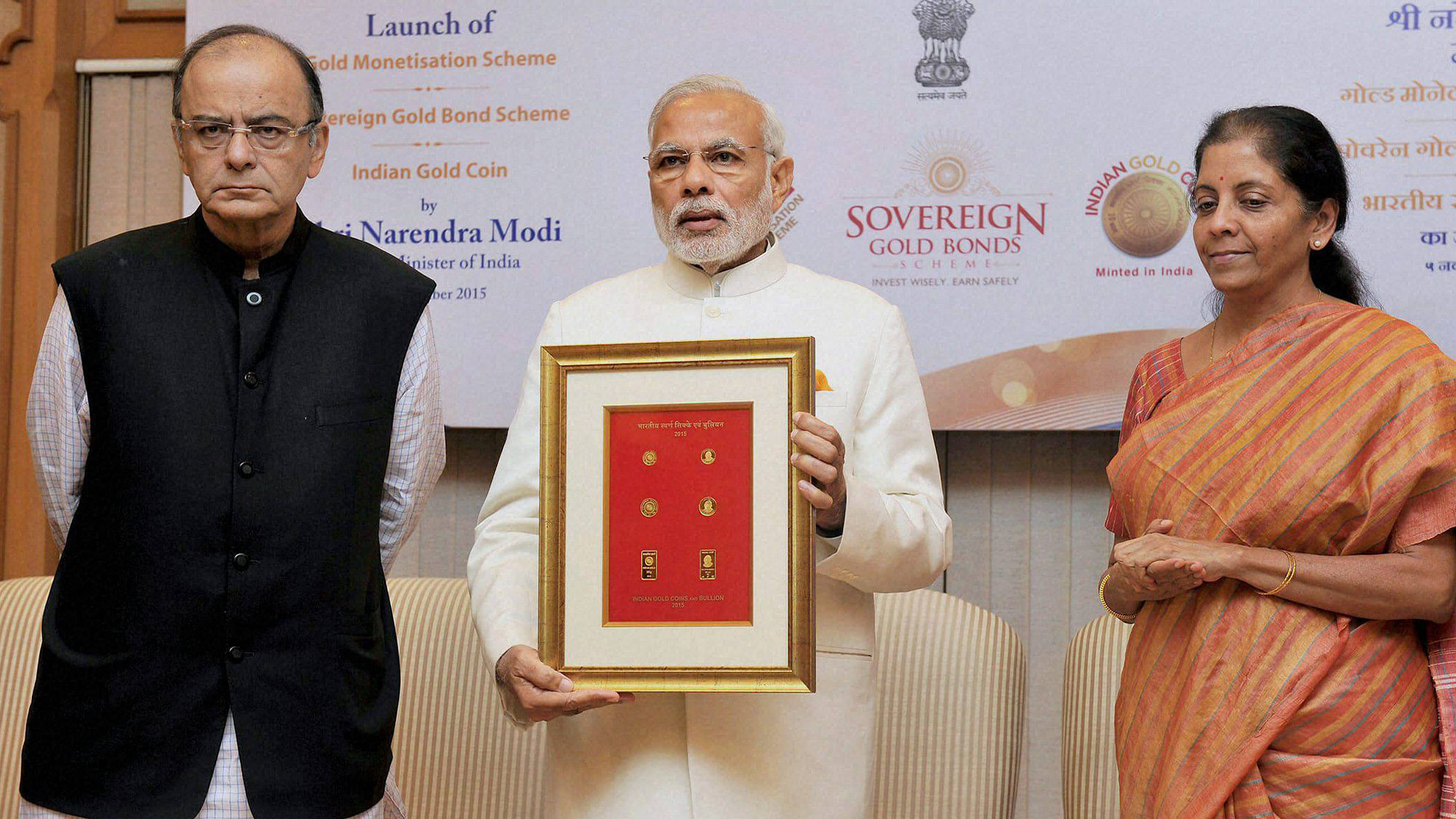 Prime Minister Narendra Modi with Union Finance Minister Arun Jaitley and the Minister of State for Commerce &amp; Industry (Independent Charge), Nirmala Sitharaman during the launch of Government Gold schemes, in New Delhi on Thursday. (Photo: PTI)