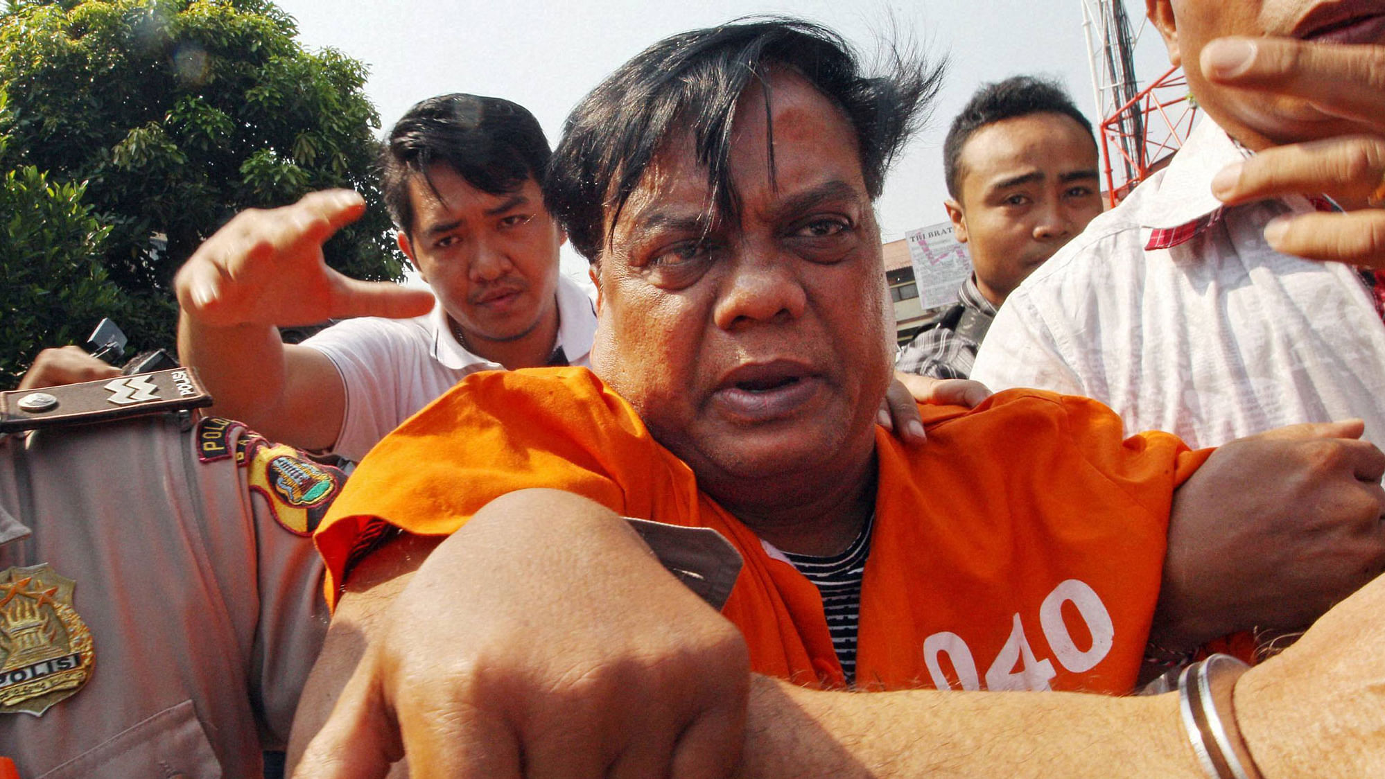 Rajendra Sadashiv Nikalje, known in India as Chhota Rajan, escorted by plain-clothed police officers for questioning in Bali, Indonesia. (Photo: PTI)